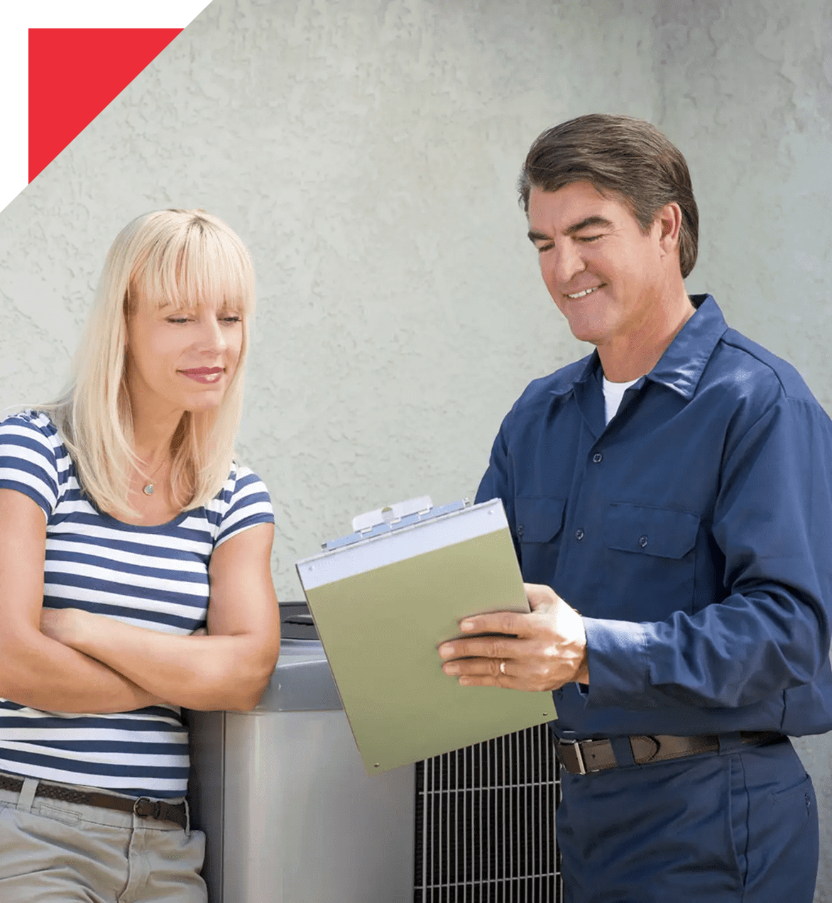 Technician reviewing HVAC checklist with homeowner